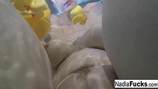 Nadia takes a bath with rubber duckies and gets horny