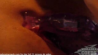 Skinny blonde model undresses and masturbates on a sofa
