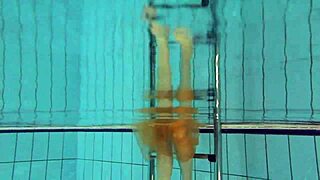 Petite teen Nastya's outdoor striptease in the pool