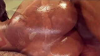 Two chocolate-skinned women having sex with a big black cock
