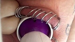 Amateur girl with a pierced pussy masturbates with a dildo