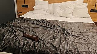 Latex clad amateur enjoys dildo insertion and blowjob alone