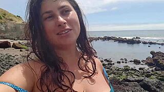 curvy brunette flashes big tits pussy on beach before sexy photoshoot