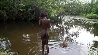 skinny african village girl bathes nude in river outdoors
