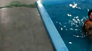 redhead enjoys pool day naked