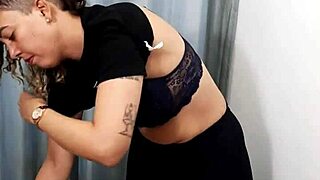 a store dressing room gets used by couple