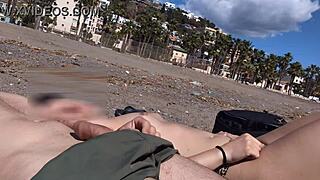 Flashing cock next to a topless girl on the beach
