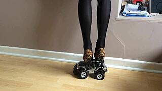 toy car gets crushed under high heels in garage