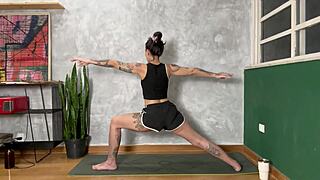 hot tattooed girl doing yoga at home