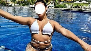 Curvy Brazilian relaxes poolside in bikini
