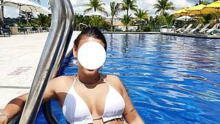Curvy Brazilian relaxes poolside in bikini