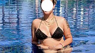 Curvy Brazilian relaxes poolside in bikini