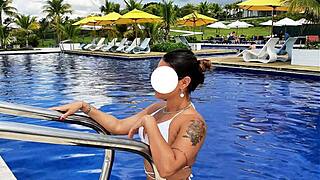 Curvy Brazilian relaxes poolside in bikini