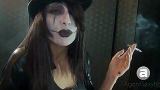 this goth chick lights up while showing off big tits