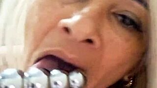 Milf plays with dildo in pussy