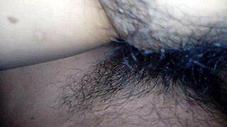 my esposa with legs wide open showing her hairy vagina to me. i can't resist touching her every day.
