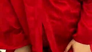 Brunette in red lingerie self-pleasures alone