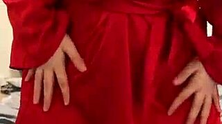 Brunette in red lingerie self-pleasures alone