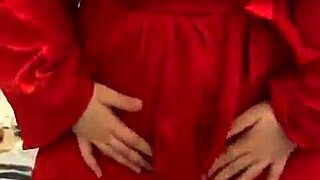 Brunette in red lingerie self-pleasures alone