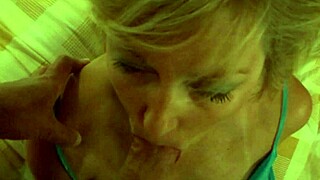 beautiful blonde milf gives blowjob and takes facial. amateurs watch in homemade scene.