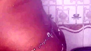 black thick ebony babe fucks and dances while bathing in the shower.