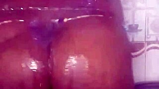 black thick ebony babe fucks and dances while bathing in the shower.