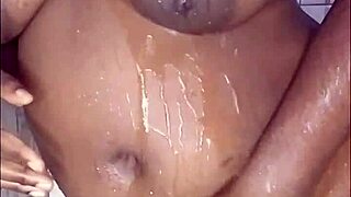 black thick ebony babe fucks and dances while bathing in the shower.