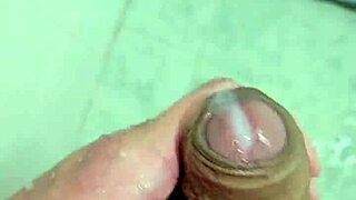 Young guy cums deliciously in the shower with neighbors watching