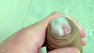 Young guy cums deliciously in the shower with neighbors watching