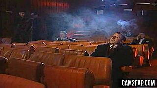 Hardcore cinema night turns into wild anal group pounding. Crowds cheer as asses get slammed.