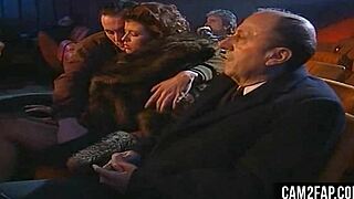 Hardcore cinema night turns into wild anal group pounding. Crowds cheer as asses get slammed.