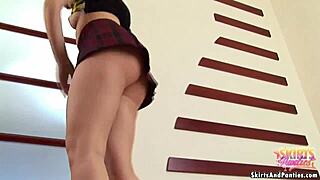 teen babe flashes her panties under skirt while cooking dinner giving upskirt views