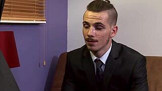 Young punk tattooed guy bouncing on boss's hard cock in office