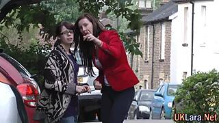 Mature woman in stockings enjoys group activity with tattooed partner