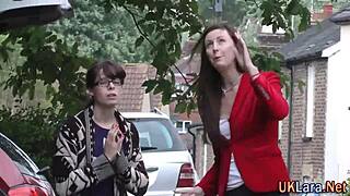 Mature woman in stockings enjoys group activity with tattooed partner