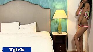 Seductive Nubian Transsexual Jerking Her Big Tits With Piercings.