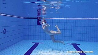 Proklova strips her bikini and swims in the pool