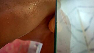 Belinda Selin in the shower impales her pussy on a big dildo for intense orgasm