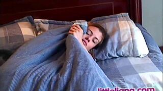 Little Liana fingering her tight pussy while sucking on natural tits