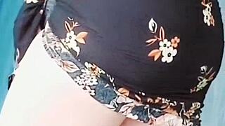 Wet sissy crossdresser twink shows big ass in pink shirt, black mini skirt, white legs on gay webcam