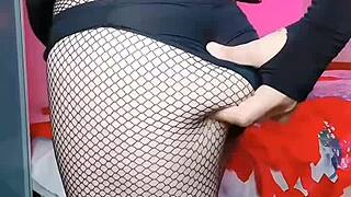 Wet sissy crossdresser twink shows big ass in pink shirt, black mini skirt, white legs on gay webcam