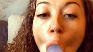 Miss Daisy Mae sucks dildo and plays with wet pussy.