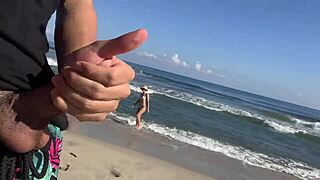 two girls look at my cock while i masturbaate on the beach and i invite them to help.