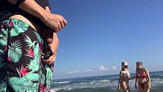 two girls look at my cock while i masturbaate on the beach and i invite them to help.