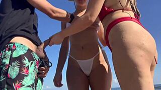 two girls look at my cock while i masturbaate on the beach and i invite them to help.