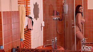 stunning busty spanish babe masturbates hard in her shower?