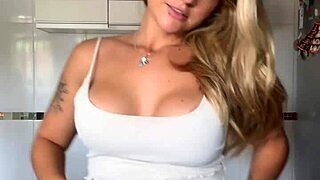 hey, check this blonde with pierced nipples shaking her big ass