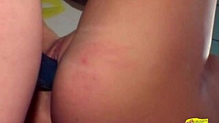 Busty blonde surprises brunette with strapon during workout