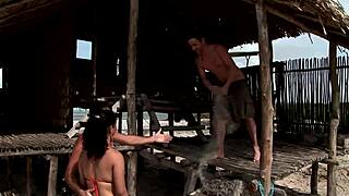 Beach orgy unfolds with group doggystyle.