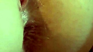 She's bent over getting her ass and pussy fucked while fingering and licking balls